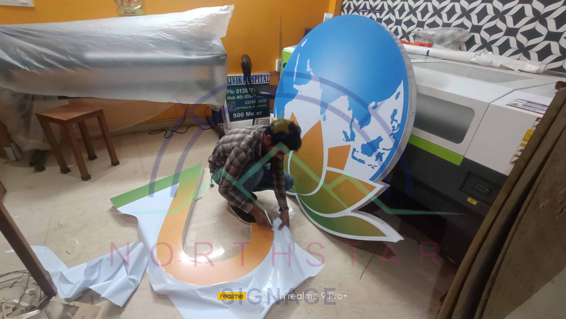 man working on 3d signage